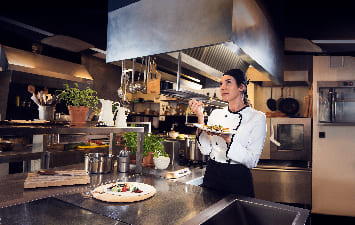 cook tasting a dish